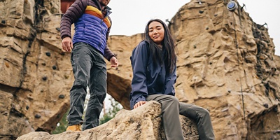 Climbers sitting on outdoor climbing wall