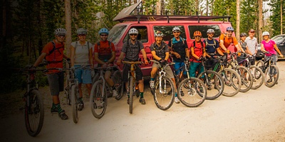 A number of policy advocates for Outdoor Alliance pose for a photo on a mountain biking trip 