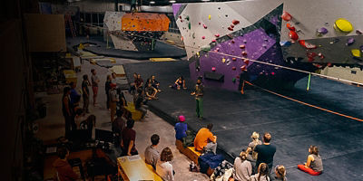 Class participants at ASCEND Pittsburgh listen to instruction on slacklining