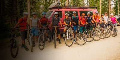 A number of policy advocates for Outdoor Alliance pose for a photo on a mountain biking trip 