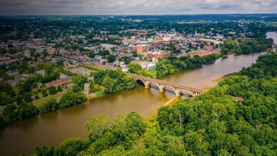 Aerial view of Fredericksburg Virginia from across the Rappahannock River with kayaks on the water