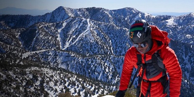 Andrew King climbs to the top of a mountain