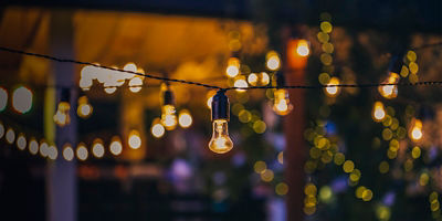 outdoor string lights hanging on a line in backyard