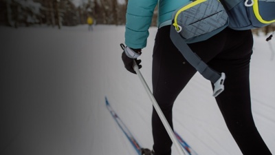 A cross country skiier skis accross the landscape