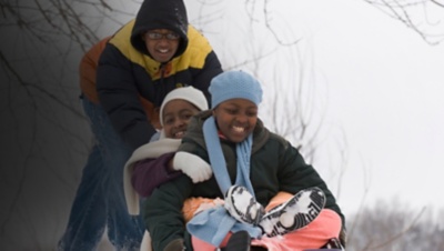 kids sledding down a hill