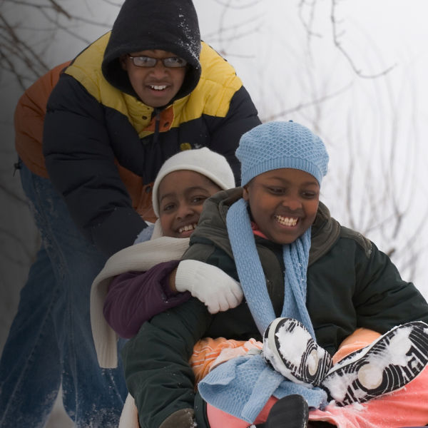 kids sledding down a hill
