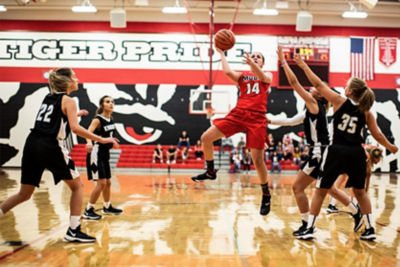 Basketball players playing a game. 