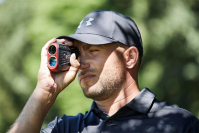 Golfer using a Bushnell Rangefinder