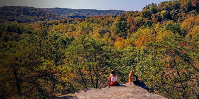 Two hikers take in the view at Christmas Rocks State Nature Preserve 