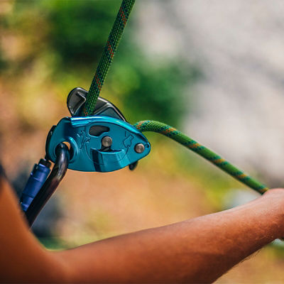 A belayer belaying from a Grigri