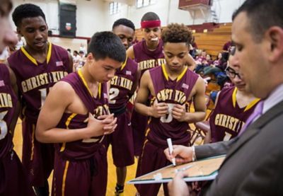 Coach talking to his team. 