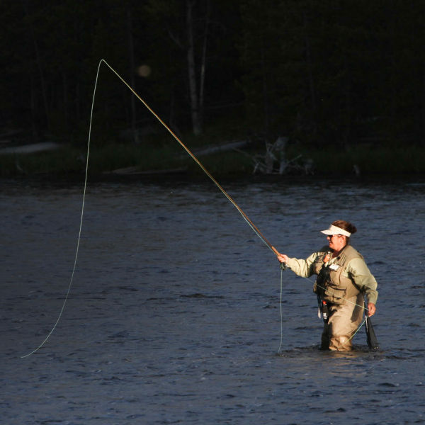 Woman fly fishing in the Firehole River.
