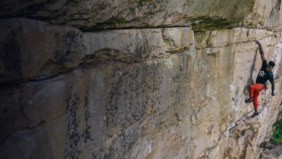 A rock climber lead climbing