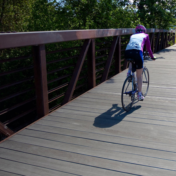 A man bikes the Bear Creek Greenway