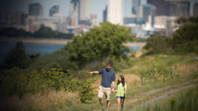 A father and a daughter hike on Boston Harbor Islands