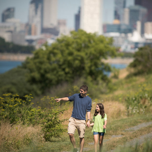 A father and a daughter hike on Boston Harbor Islands