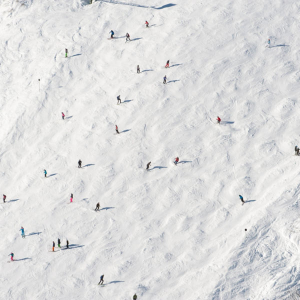 skiers on a ski slope in the distance