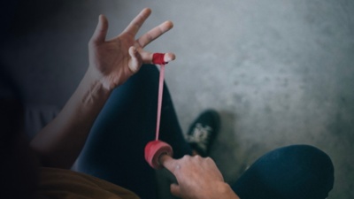 A detail of a climber applying climbers tape to hands