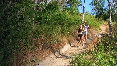 Two people run a race at Jackson Forest Park Trail 