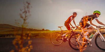 Two cyclists cycling on the road