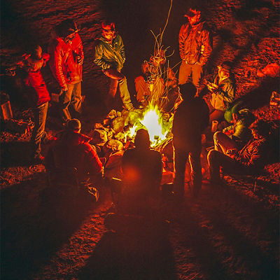 A group gathers around a campfire in Southern Utah