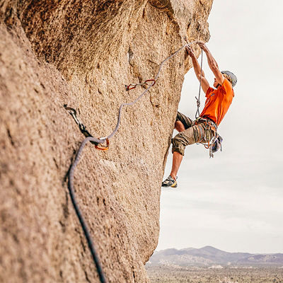 A man climbs on Sole Fusion (5.12a) in Joshua Tree National Park.