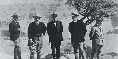Theodore Roosevelt (second from left) and his party posing at the rim of the Grand Canyon.