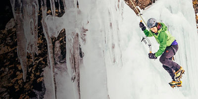 A woman is ice climbing in New Zealand, Otago, Wye Creek basin.