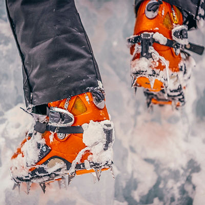 The boots and crampons of an ice climber.