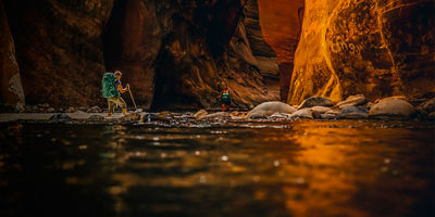 People hiking the Narrows in  Zion National Park, Utah