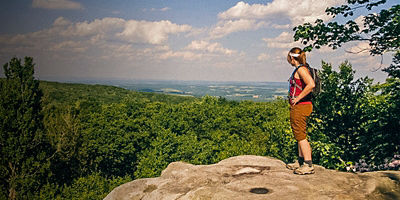 A woman hiking along the  Laurel Highlands Hiking Trail (LHHT)
