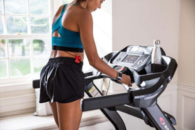 Woman on treadmill in her home