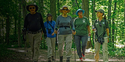 Hikers on the Dripping Rock Trail at Highbanks