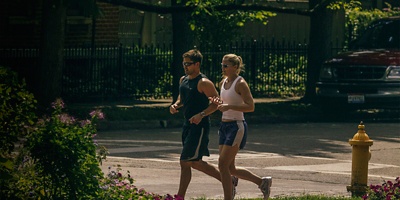 A man and woman runner in Schiller Park within German Village