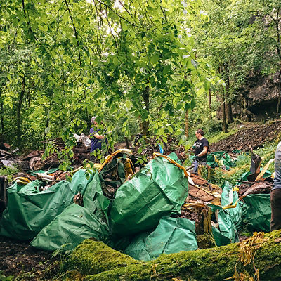 Volunteers clean up trash around the Mad Giver Gorge