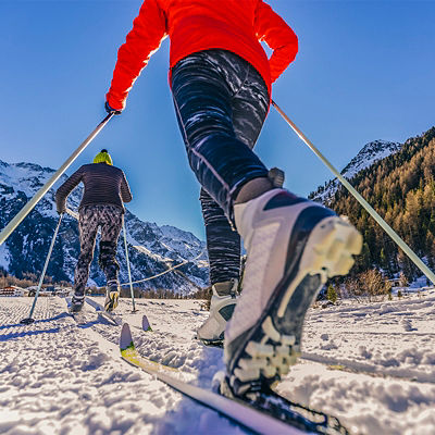 A family group of cross country skiers on a sunny winter morning in Italy Alps, Souty Tirol, Solda.