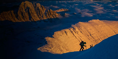 A mountaineer on ridge at sunset; Lake County, western Montana