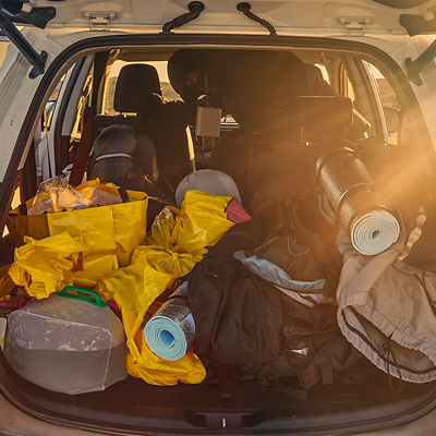 Trunk of a car loaded with travel camping equipment in Iceland