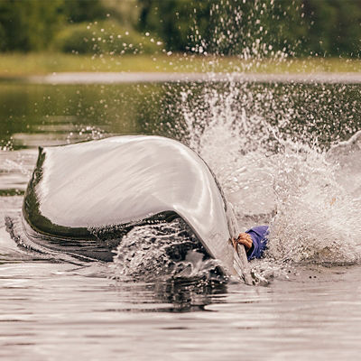 A canoe capsizes in the water