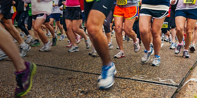 Legs of runners running a 10K race