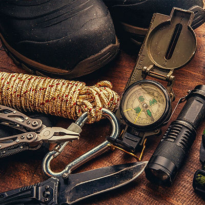 Outdoor survival gear including a compass, a rope and a knife