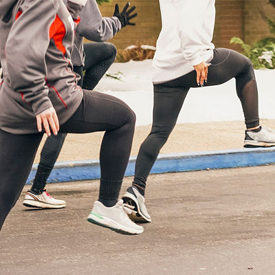 People running high knee running drills