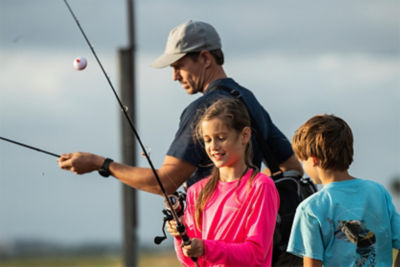 father with son and daughter holding fishing poles