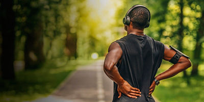 A man rubbing his injured back