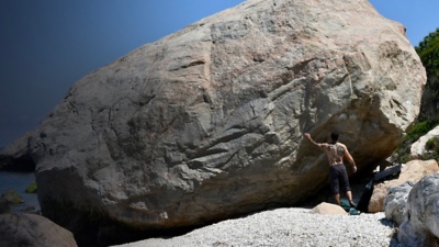 A man looks at a boulder problem at East Marion