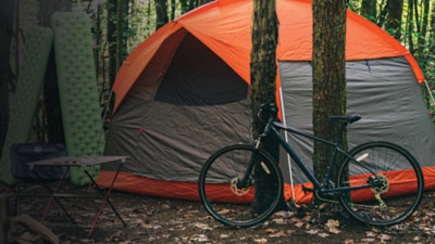 A tent is seen in a set up campsite