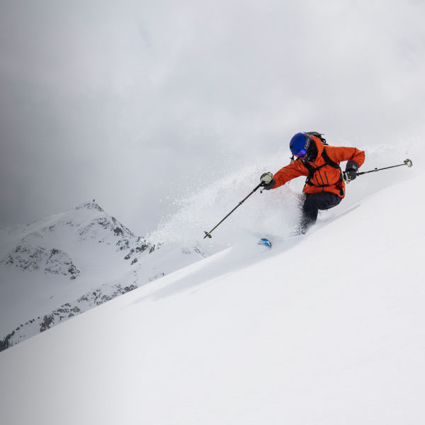 An action shot of Connor Ryan skiing 