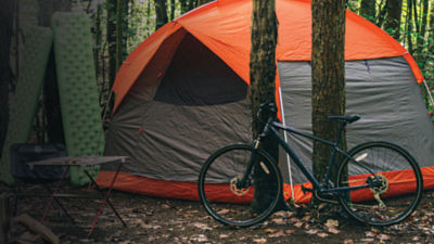 A tent is seen in a set up campsite