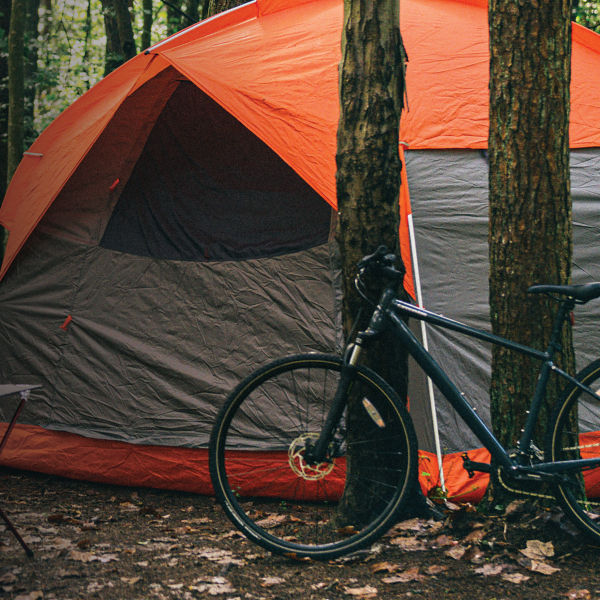 A tent is seen in a set up campsite
