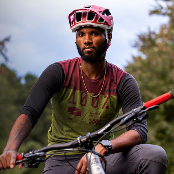 Angelo Wash poses outside with his bike